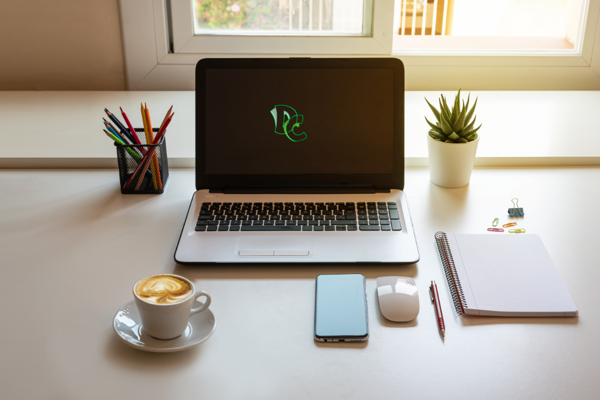 A picture of a laptop and a cup of tea.